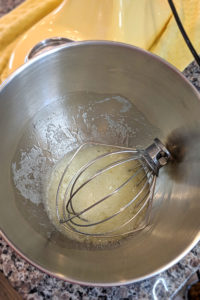 Combine the egg whites and sugar with the whisk attachment.