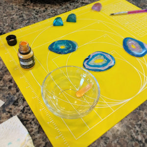 Adding gold trim to the isomalt agate slices