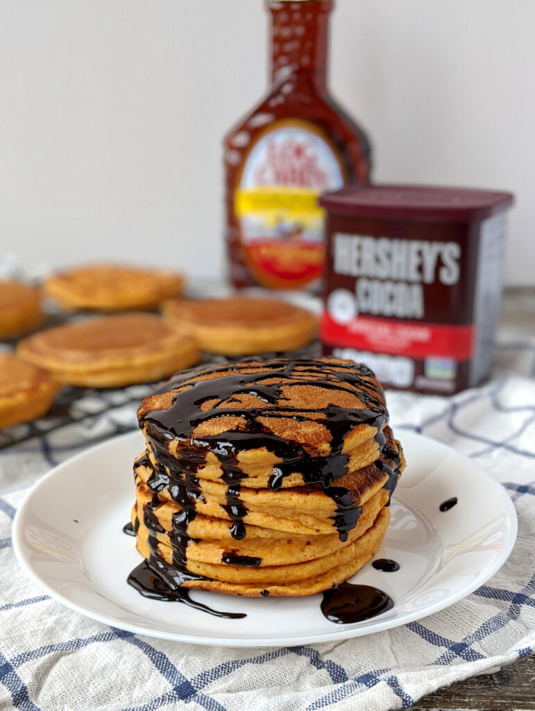 Pumpkin Pie Pancakes with black chocolate syrup