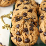 Brown Butter Espresso Chip Cookies on a forest green serving tray