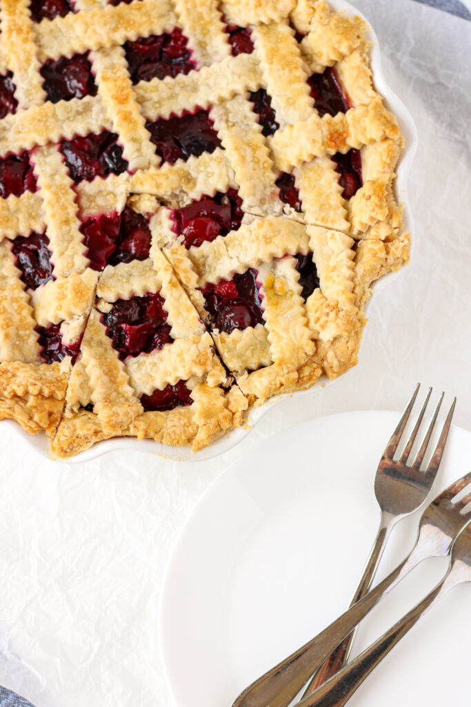 Cherry Pie with plates and forks