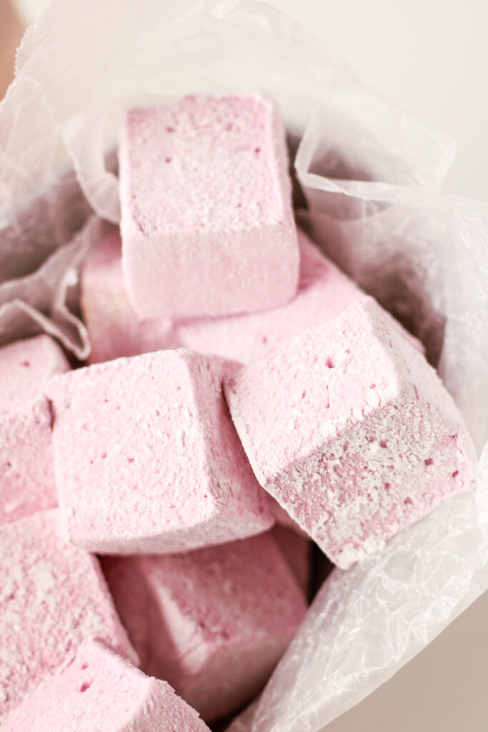 Boozy Tropical Hibiscus Marshmallows in a metal tin