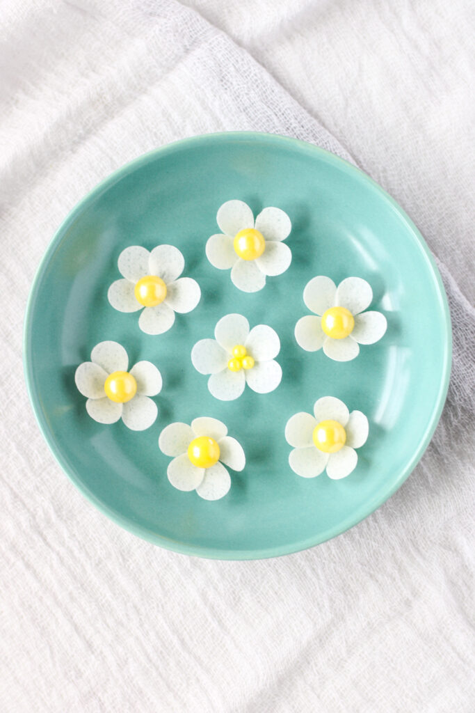 wafer paper flowers in a small dish