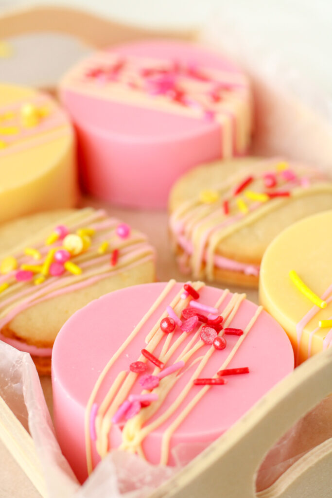 Pink and yellow treats with cookies. Drizzled with chocolate and topped with sprinkles