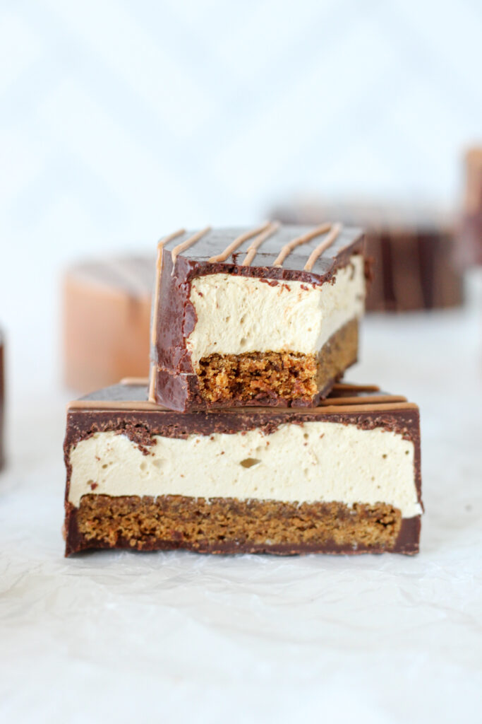 Gingerbread Marshmallow Bite - chocolate shell filled with molasses marshmallow and a chewy gingerbread cookie base