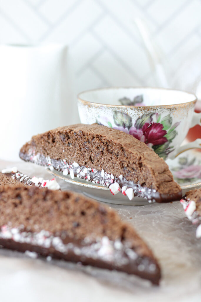 Chocolate Peppermint Biscotti on a saucer with a teacup