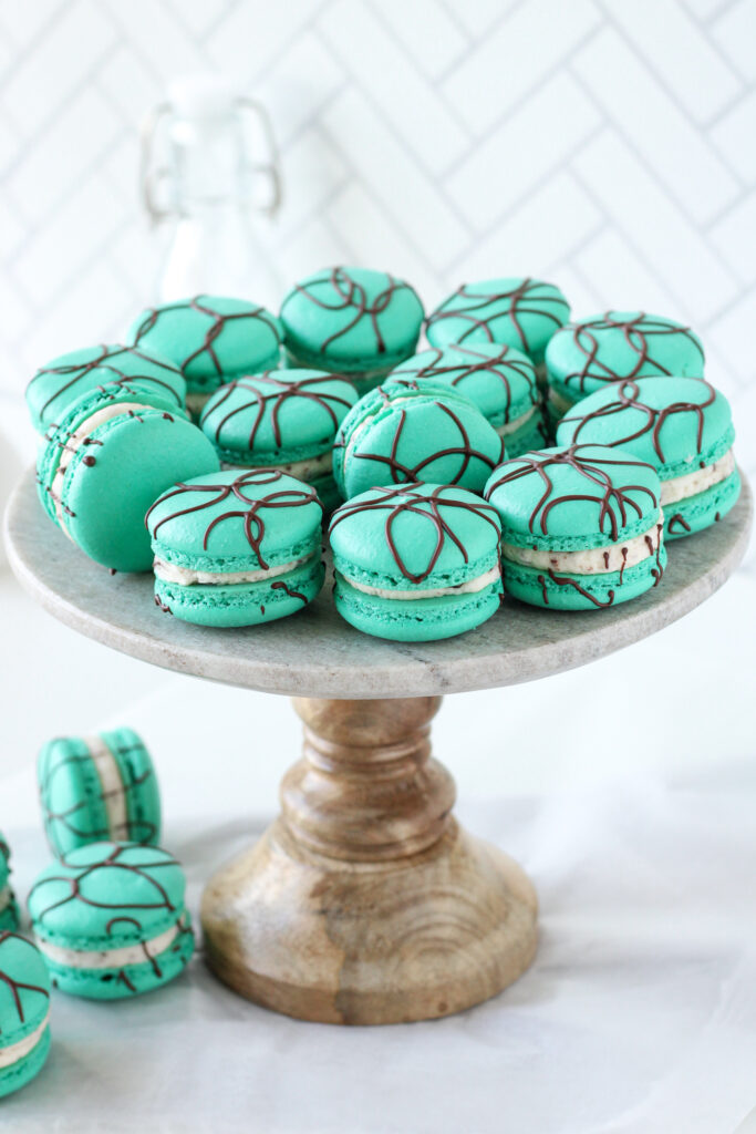 Peppermint Chip Macarons on a cake stand