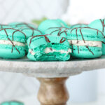Peppermint Chip Macarons on a cake stand