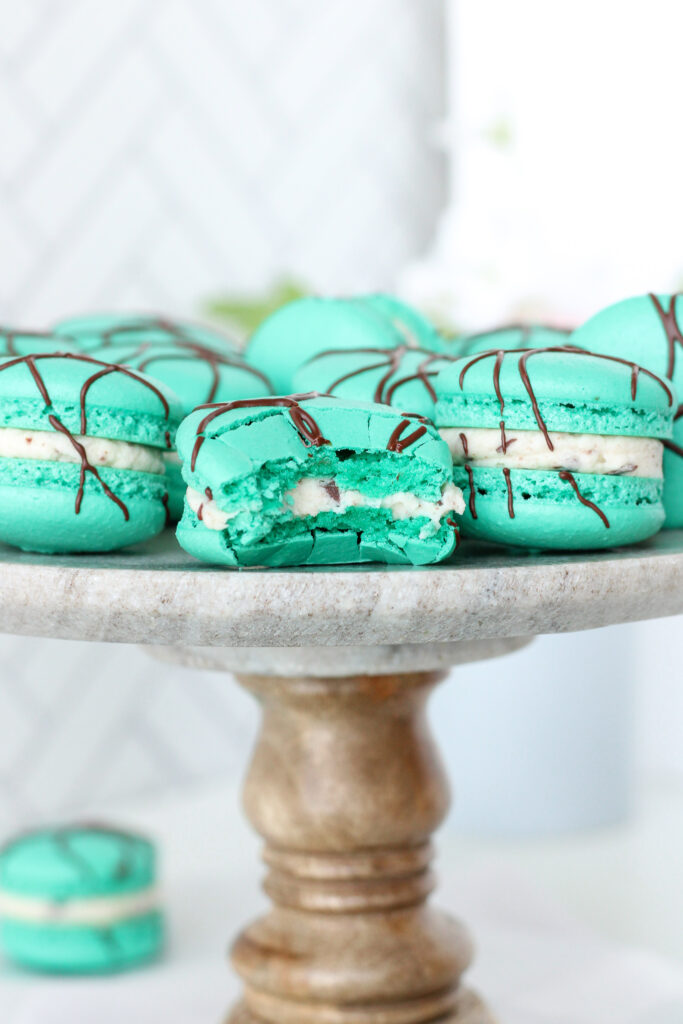 Peppermint Chip Macarons on a cake stand
