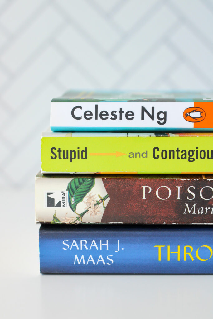 Stack of books on a white tabletop