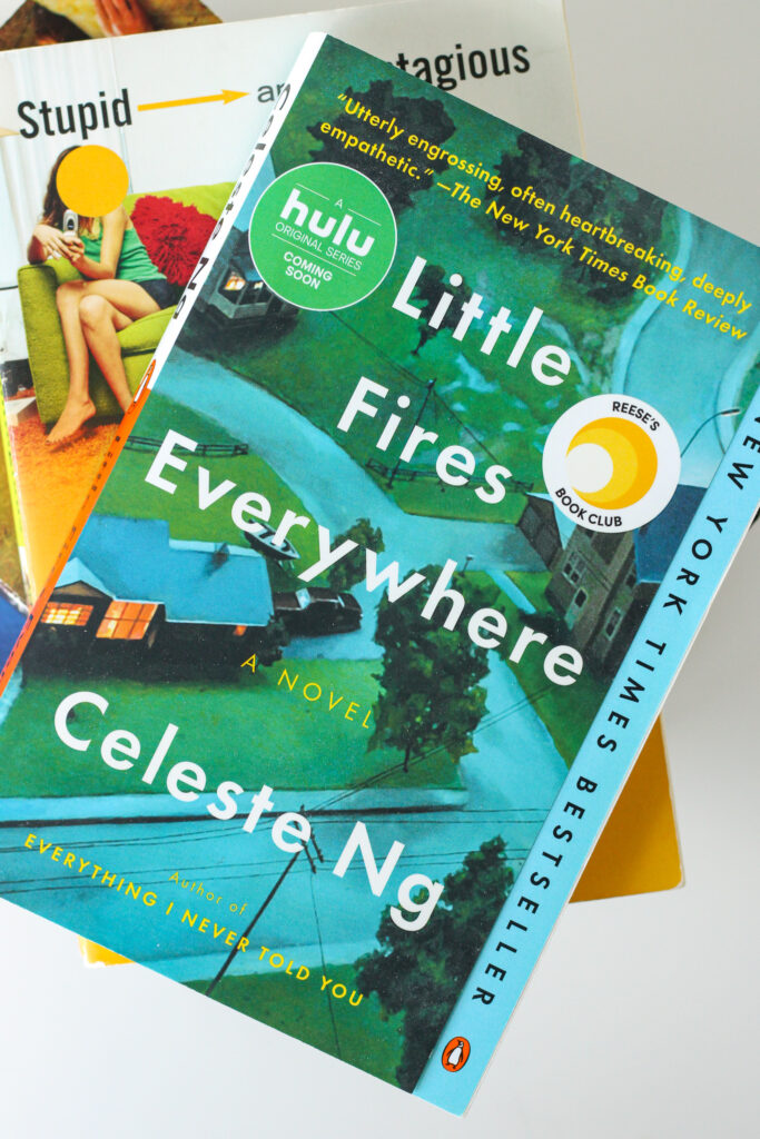 Picture of Little Fires Everywhere on a stack of other books