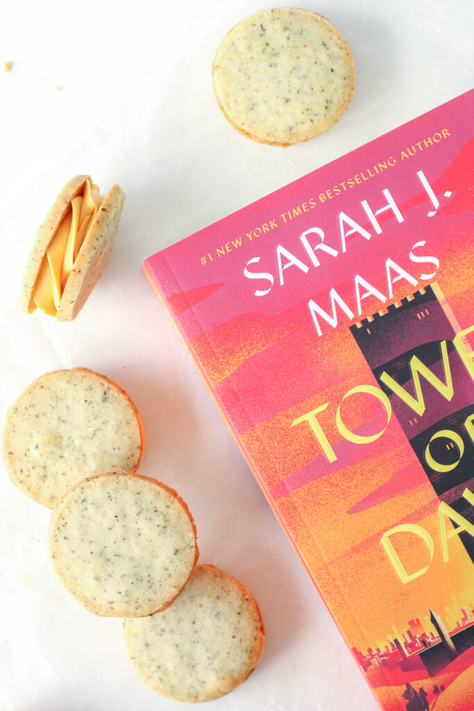 Honey Mint Sandwich Cookies and a copy of Tower of Dawn (book)